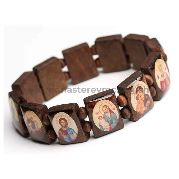 Wooden bracelet with orthodox icon on embossed beads on a white background