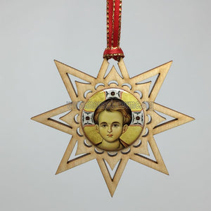 Christ Emmanuel wooden star Christmas ornament sold by the sisters of monasterevmc.org / Décoration de Noël en bois de Christ Emmanuel, dans une étoile en bois vendue par les soeurs du monasterevmc.org