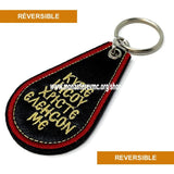 Orthodox key chain imported from Greece. black woven with IC XC NI KA gold embroidery in the front and the prayer to the Theotokos in English on the back. / Porteclé orthodoxe tissé noir avec broderie en or importé de la Grèce vendu par les soeurs du monasterevmc.org